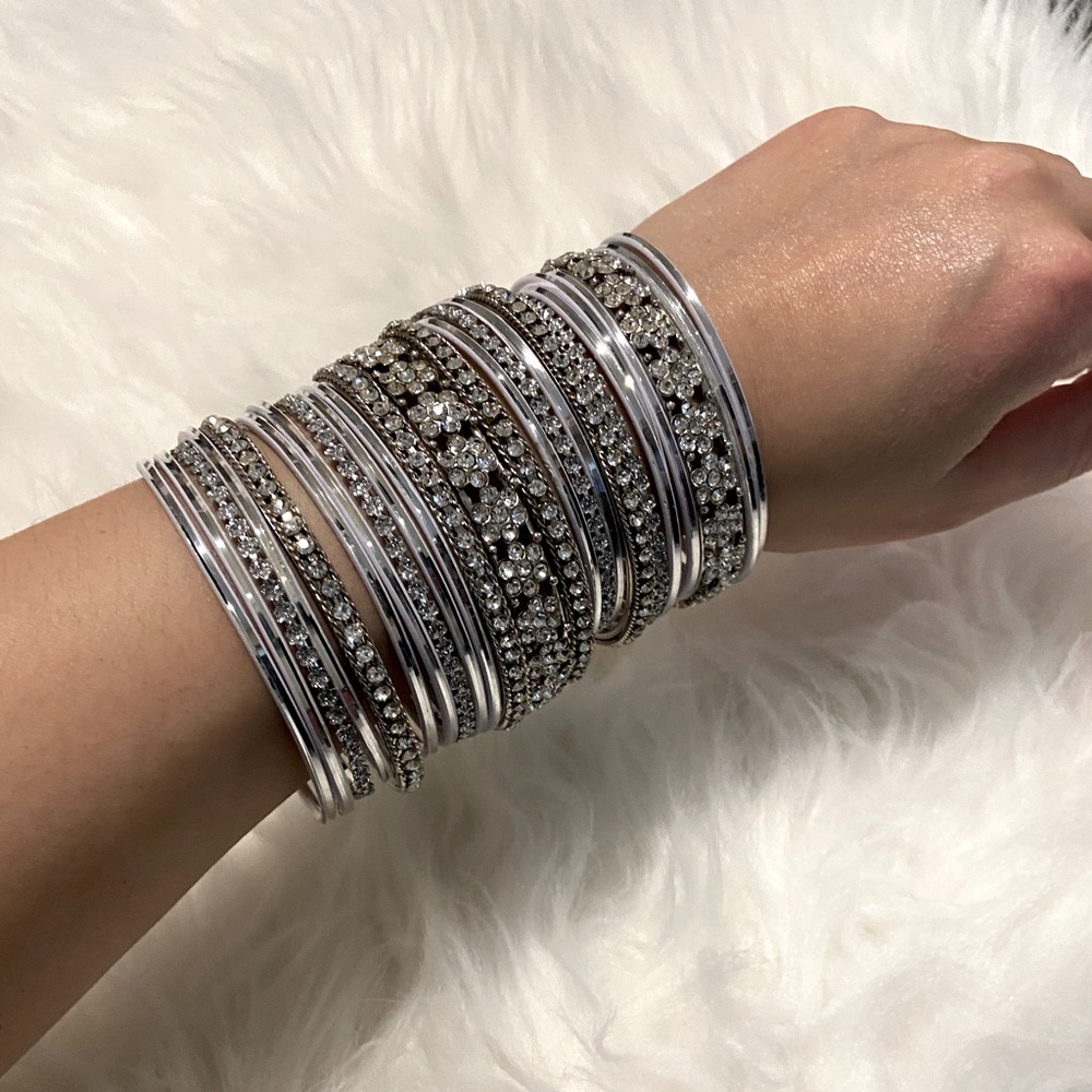 Assorted silver and white bangles